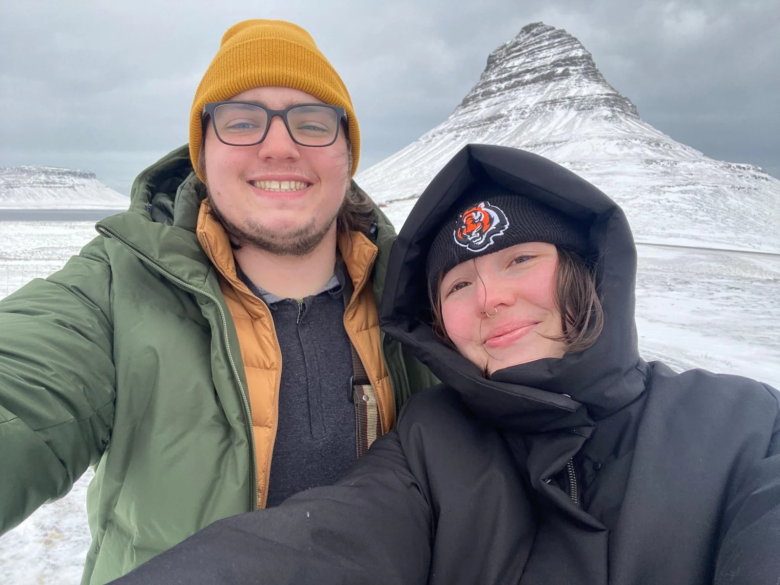 Kevin and Kendall together in front of snow-covered Kirkjufell in Iceland